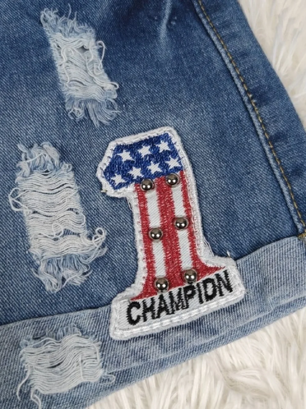 Distressed Blue Denim Shorts with Champion Patch